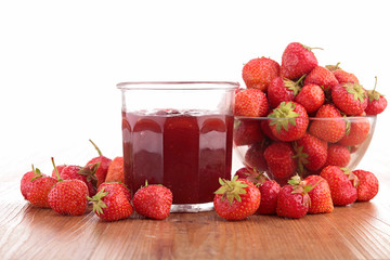 strawberry jam on wood background