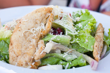 Healthy salad with chicken and vegetables in bowl