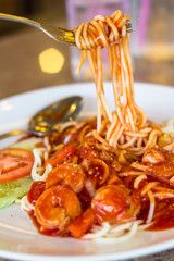 Spaghetti with tomato sauce and shrimp.