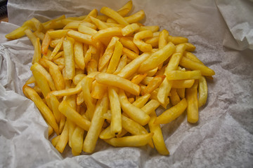 A group of tasteful yellow salty fried potatoes