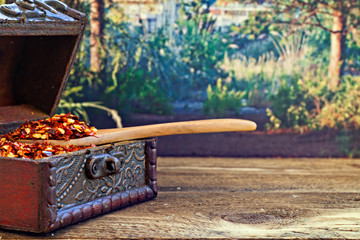 Dried red chilli flakes on rustic wooden table