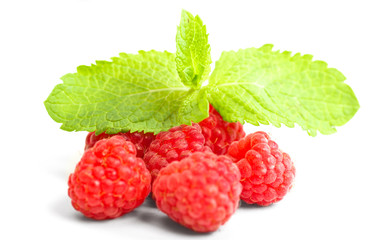 ripe red raspberry with mint leaves