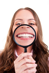 Woman showing her teeth thrue magnify