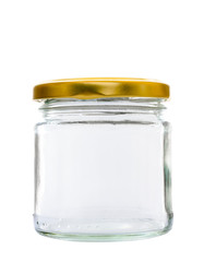 Transparent glass jar on white background, with the closed gold color top