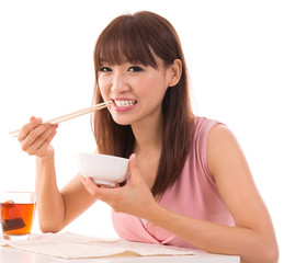 Asian woman eat rice