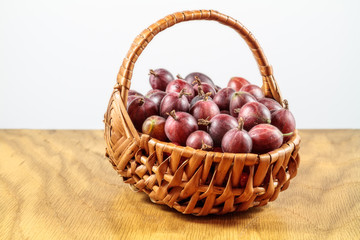 Gooseberries in  a wickerwork plaited basket