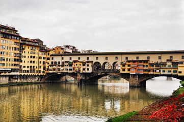 Fototapeta na wymiar Florence with reflections in the Arno River. Italy