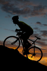 Obraz premium Silhouette road bike uphill