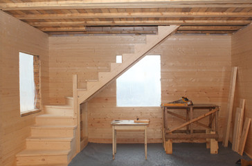 Wooden loft stairs under conctruction - working place