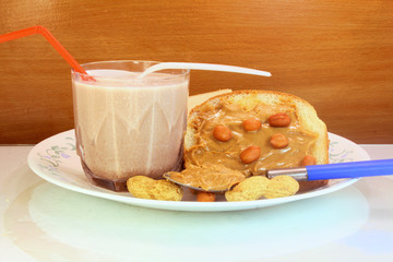 chocolate peanut butter milkshake with buttered bread closeup