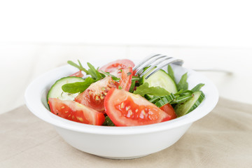 served plate with mix salad from tomatoes and cucumbers