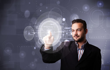 Attractive businessman touching abstract high technology circula