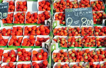 display of belgian strawberries in a market