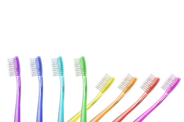 Multi-colors toothbrushes on white background