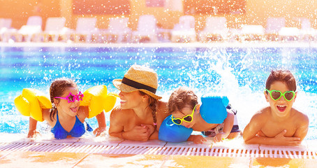 Happy family in the pool - 54788493