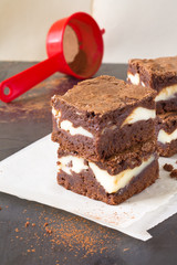 Pieces of chocolate cheesecake brownies