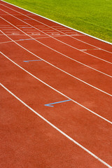 Fototapeta premium Starting lines at stadium, white lines on the track.