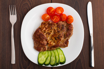 Grilled steak on white plate