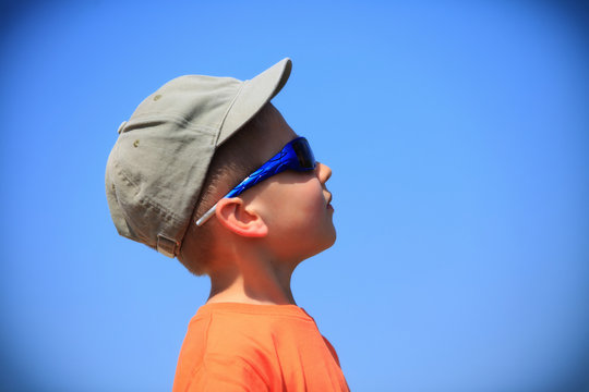 Kid With Sunglasses And Cap Outdoor