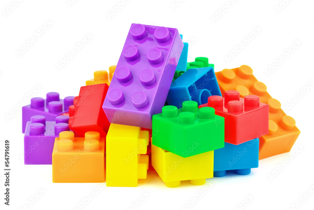 Wall mural toy colorful plastic blocks on white background