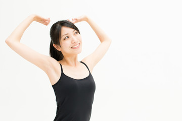 Fototapeta premium attractive asian woman exercising on white background