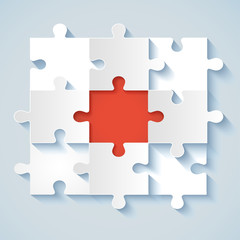 Paper puzzle with red the middle for business concepts