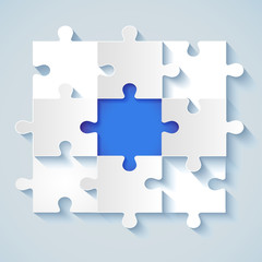 Fototapeta premium Paper puzzle with a blue the middle for business concepts
