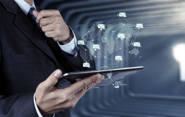 businessman hand use smart phone computer with email icon as con