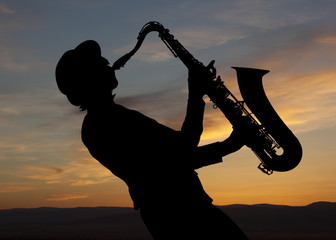 Saxophonist at sunset