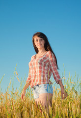 Pretty brunette in a field