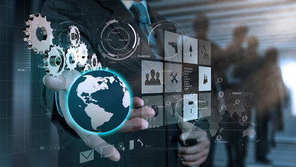 businessman hand draws gear to success