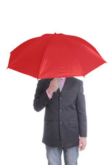 Businessman holding red umbrella
