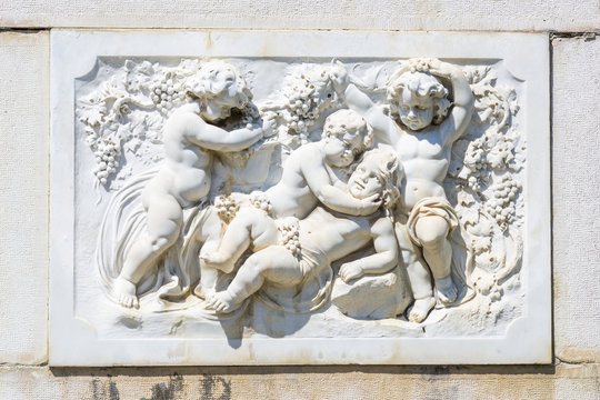 Bas-relief marble sculpture with babies