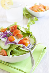 Healthy Salad with tomato, onion, cucumber and lettuce