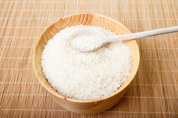 White Rice in Bowl with Wood Spoon
