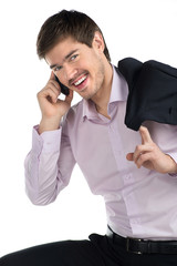 Successful businessman. Cheerful young man talking at phone and