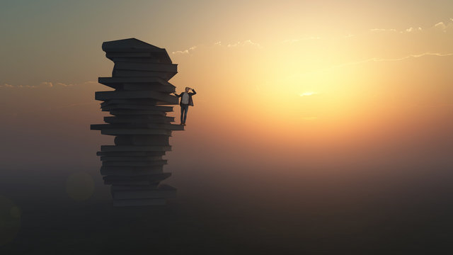 businessman standing on a stack of books
