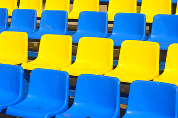 Empty plastic seats in a stadium