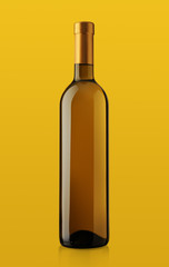 bottle of white wine on yellow background