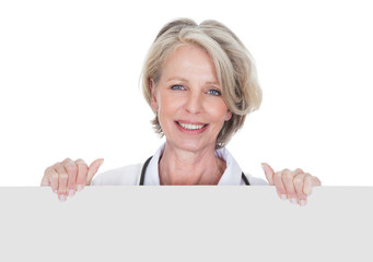 Female Doctor Holding Placard