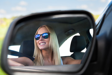 Fototapeta na wymiar Young Woman Driving Car