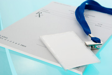 Empty medical prescripion and ID tag on blue background