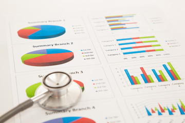 Financial charts and graphs with pen