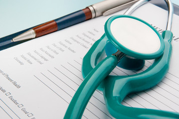 Medical Questionnaire with stethoscope on blue background