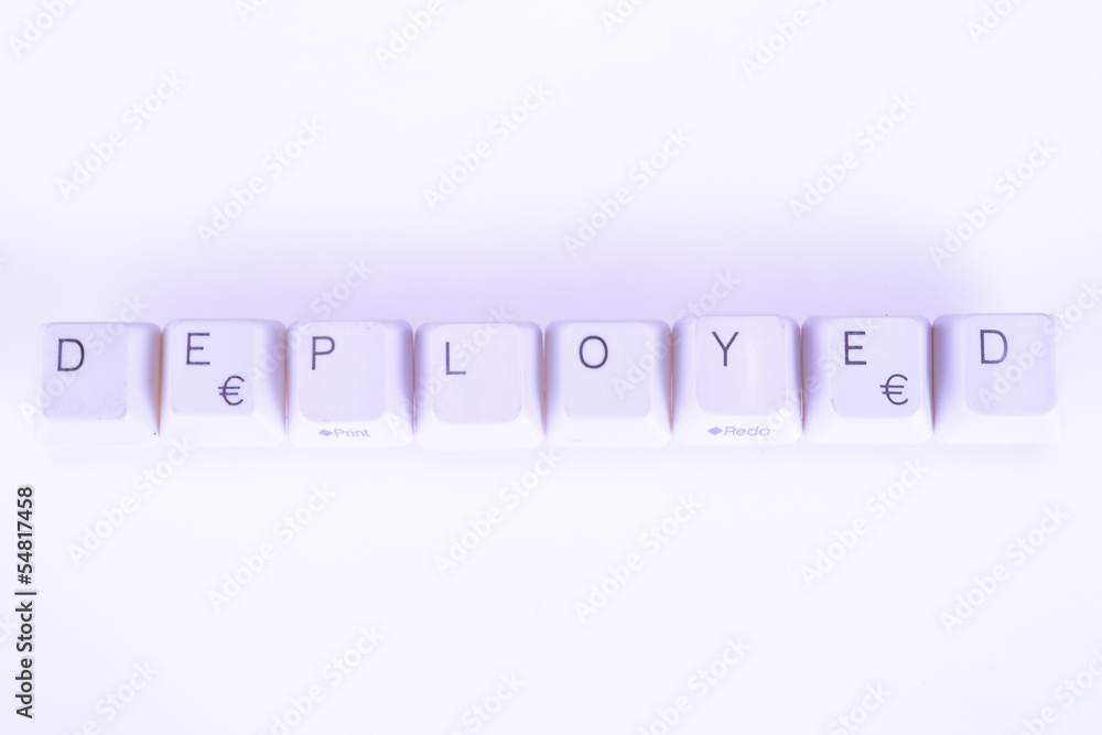 Fototapete deployed word written with computer buttons