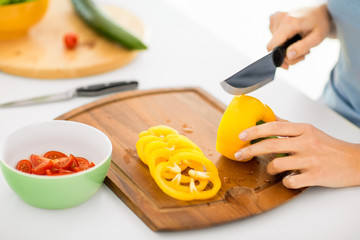 woman hands cutting vegetables
