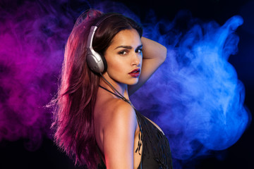 Sexy brunette listening music