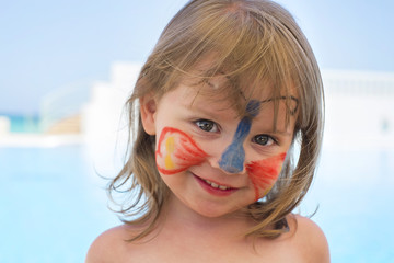 Cute little girl with butterfly face painted