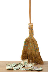 Broom sweep the dollars on white background