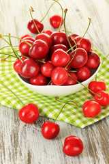 Cherry berries on wooden table close up